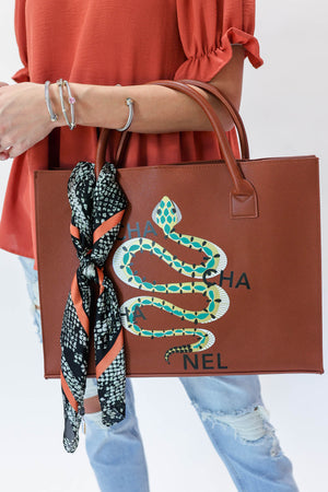Wrapped In Smiles Snake Print Scarf In Rust